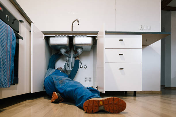 Professional Drain Cleaning technician working in Rock City, IL